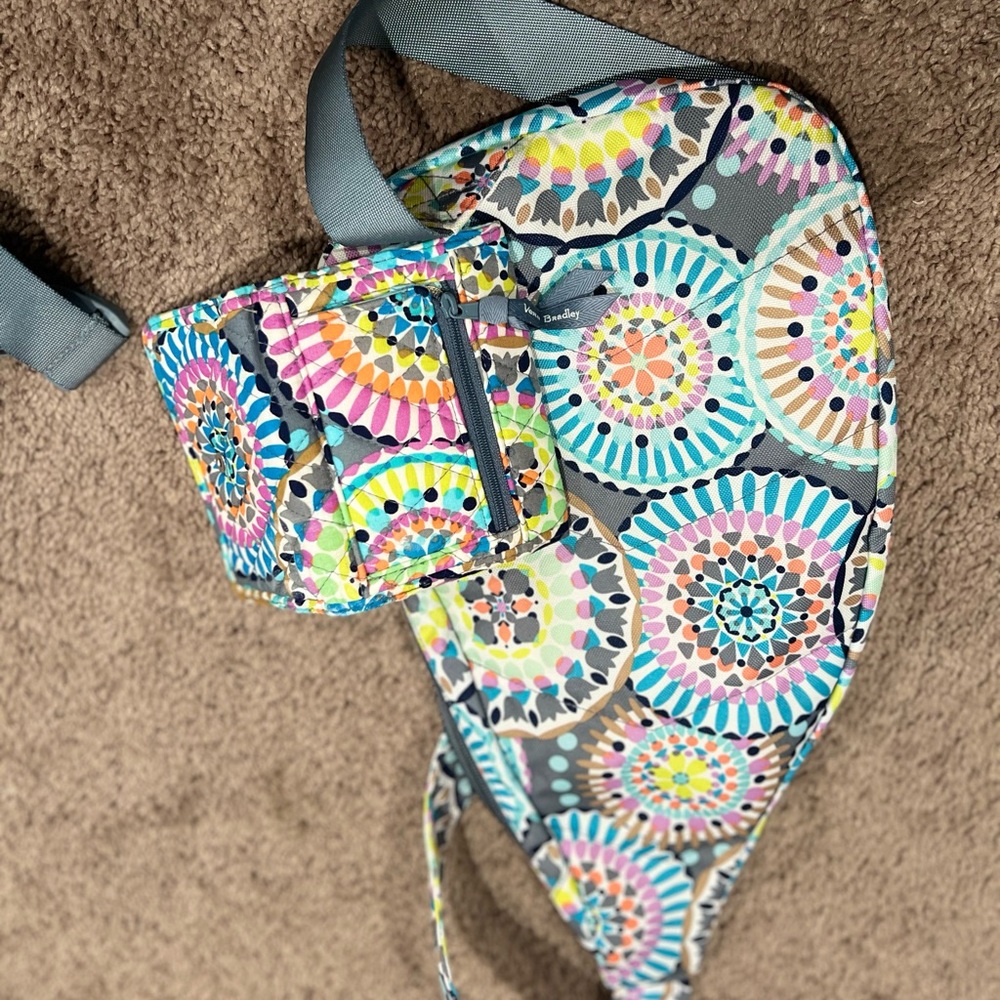 Vera Bradley sling bag that can also be used as a belt bag and matching wallet.